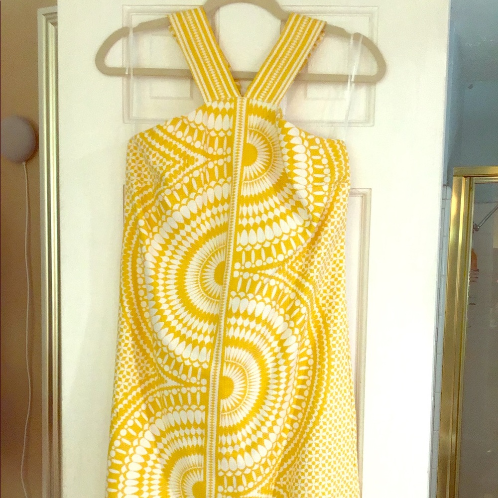 Yellow and white dress by Taylor.